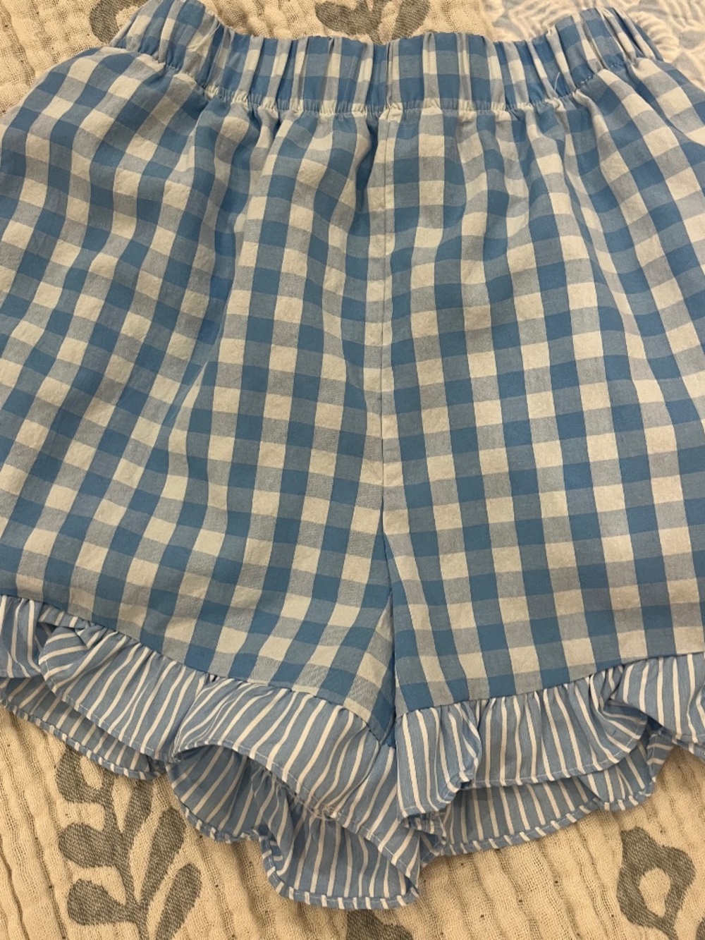 Blue and white ruffled hem shorts